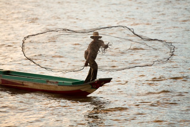 Fisherman on Tonle Sap lake, Cambodia